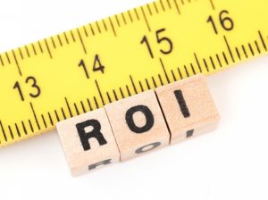 Ruler measuring blocks with the letters "ROI"