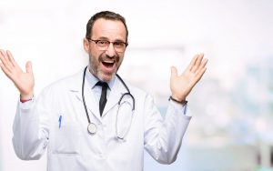 Happy practice owner because he sold his medical practice.